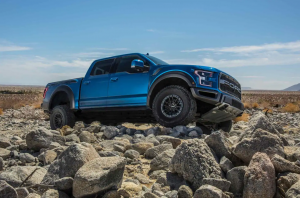 Blue Ford Raptor on Rocks